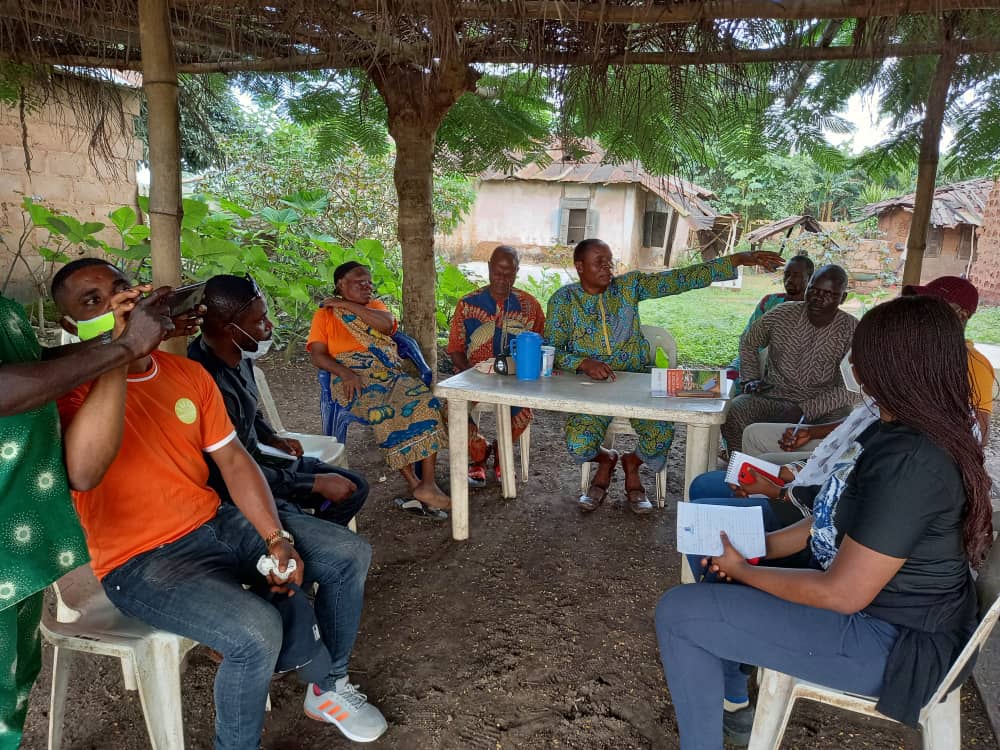 Aviralight representatives meeting with community members to discuss program results